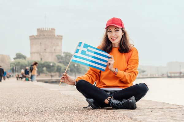 Woman in front of the White Tower in Thessaloniki